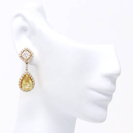 Dazzling Radiant And Pear Earrings (7.12 ct)